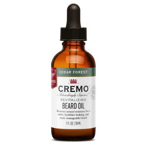 Bote con dispensador de gotas conteniendo aceite para la barba masculina. De la marca Cremo