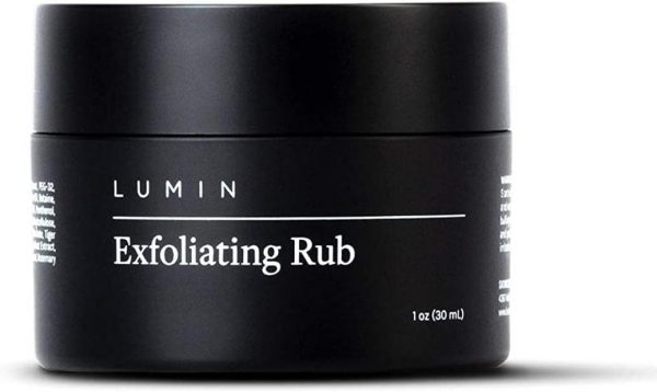 Bote color negro conteniendo exfoliante y limpiador para la piel de la cara masculina, de la marca Lumin